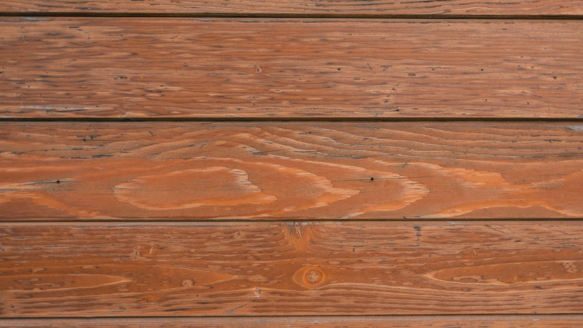 Composite and wood deck boards side by side