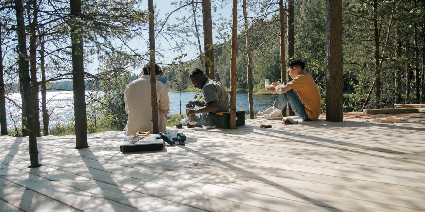 Small deck-building crew framing a new deck in Saginaw, Michigan