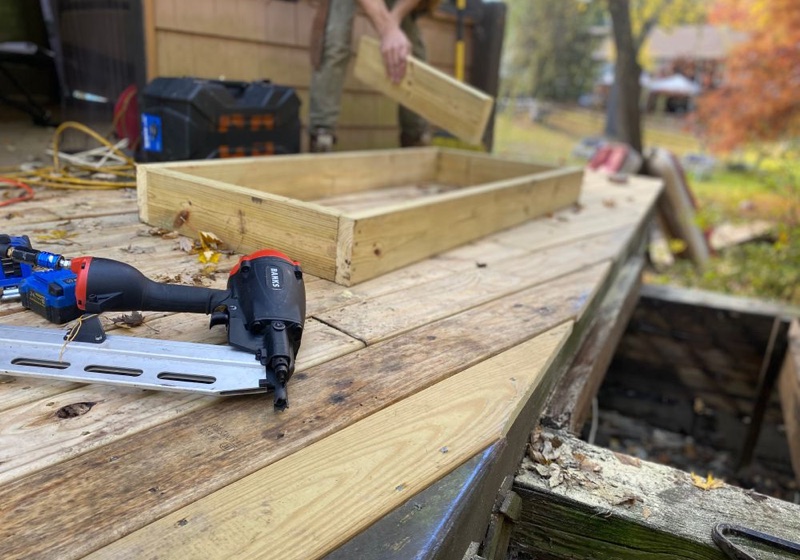 Rotted deck boards being replaced on a Saginaw, MI deck